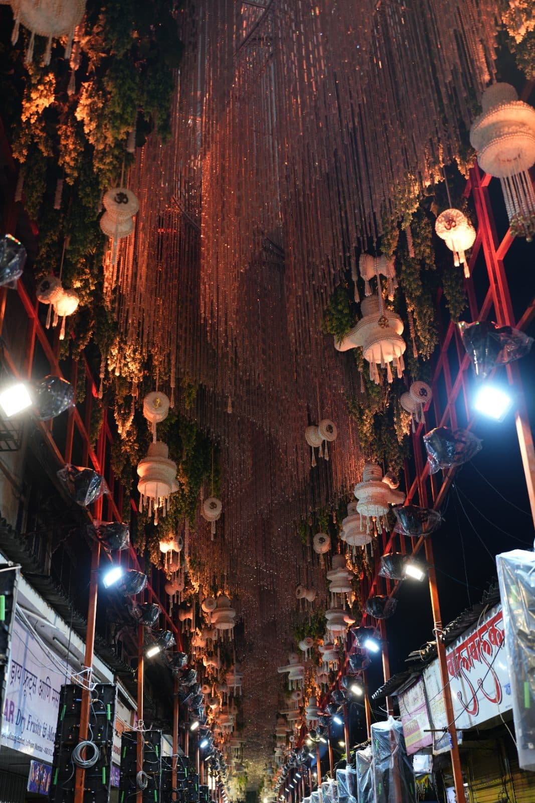 The decorated approach beneath a suspended floral installation