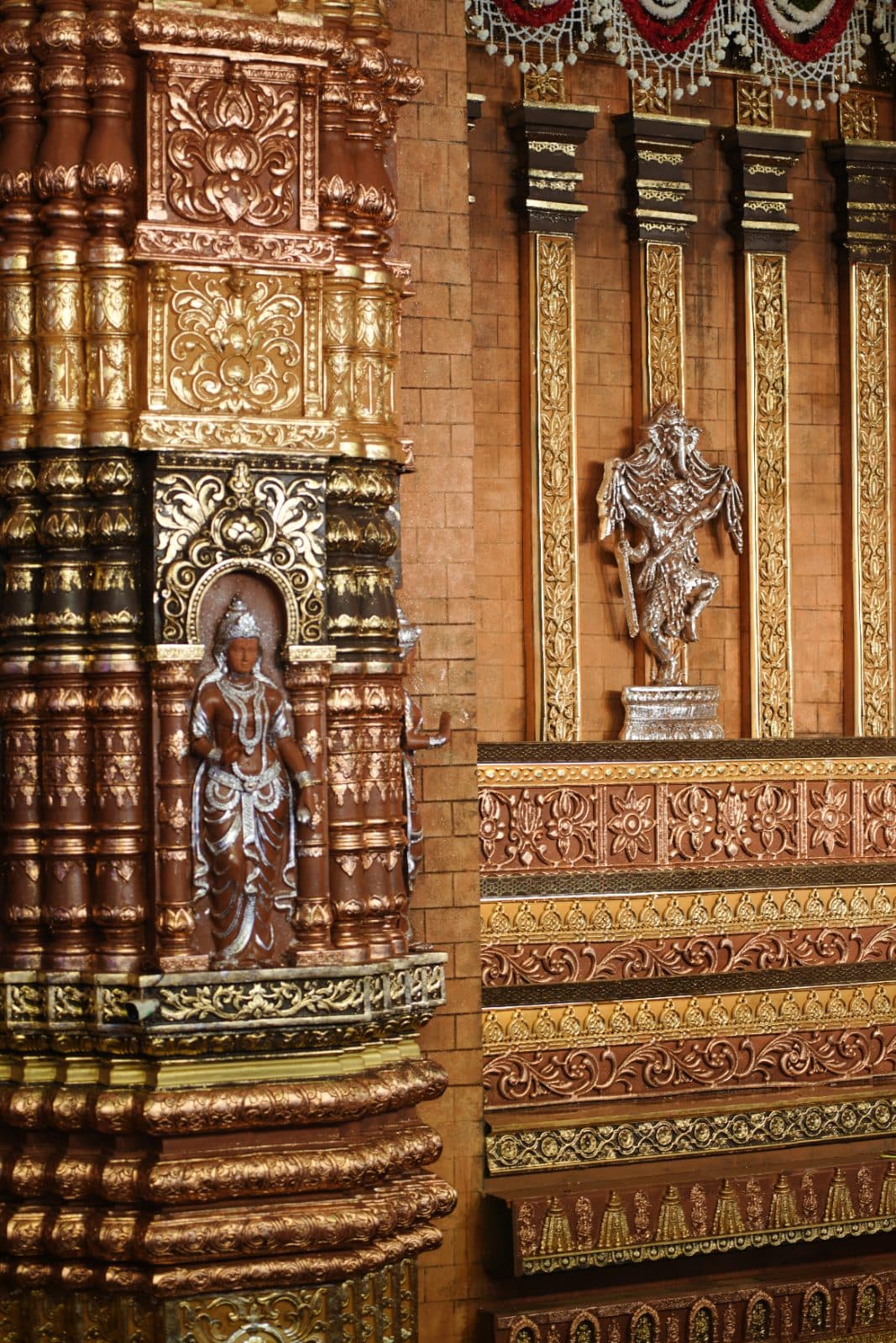 Carved figures and layered ornament on the facade