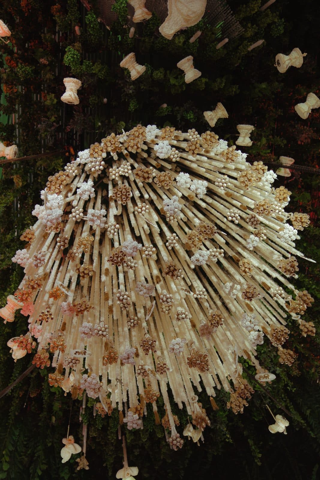 Sculptural cream and gold floral canopy detail