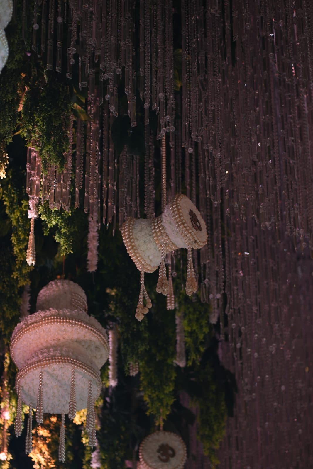 Pearl floral forms suspended among crystal strands
