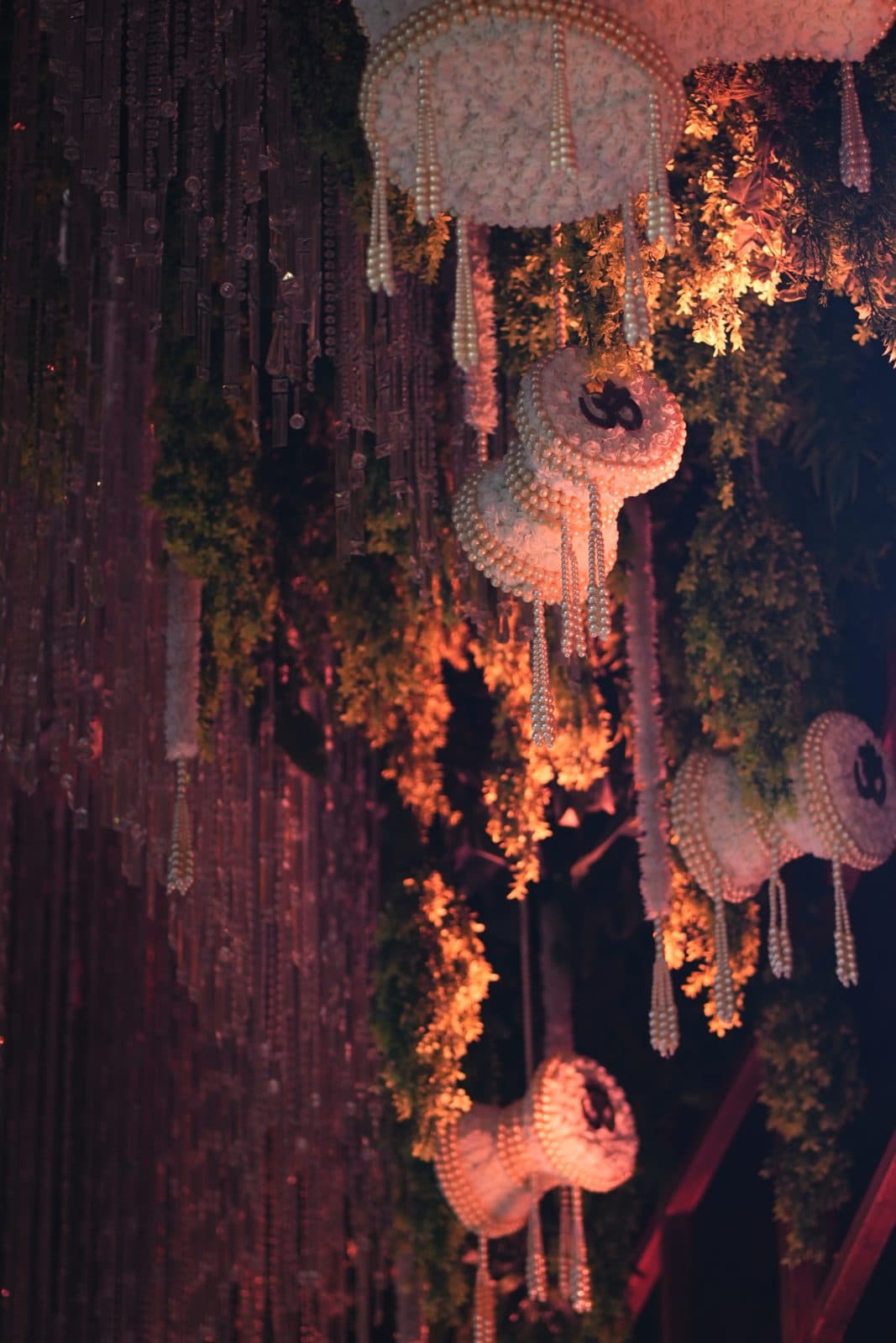 Pearl and floral forms suspended through warm light