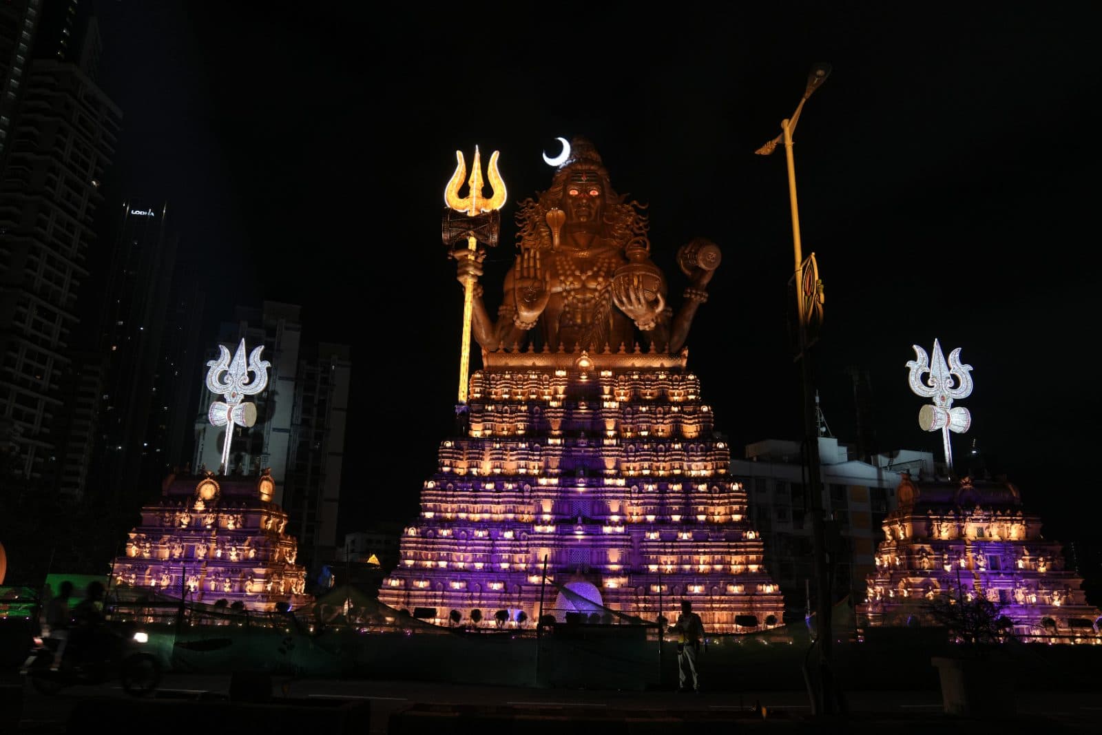 Panoramic night view of the monumental Shiva temple installation