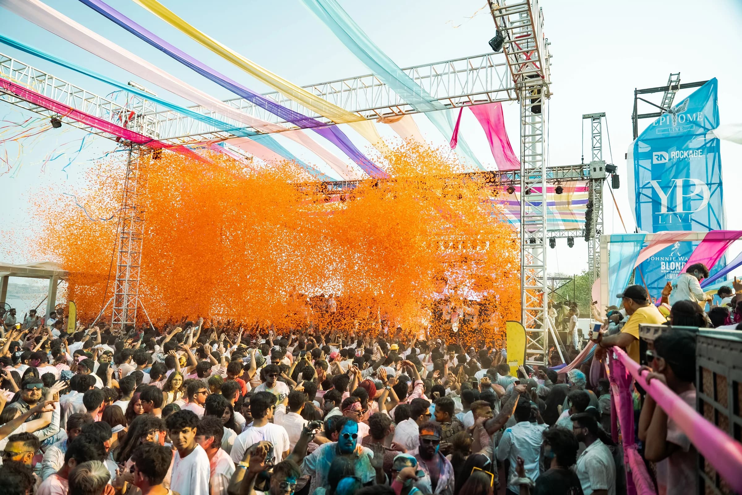 Holi at the Bay crowd surrounded by orange powder