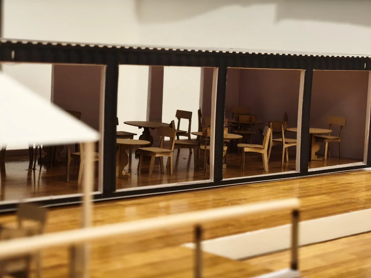 Close physical model study of the container cafe facade and framed window