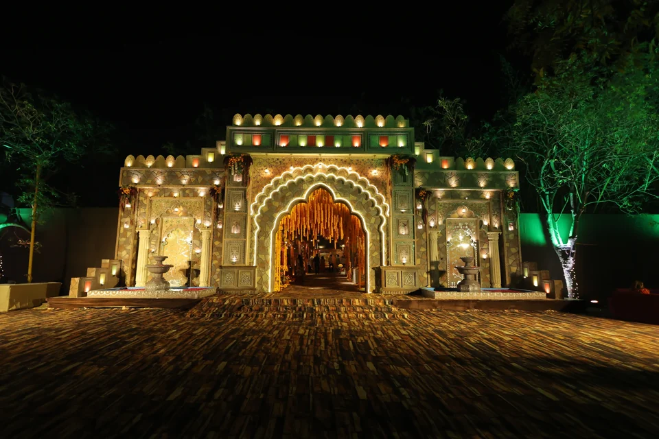 An illuminated entrance composed for a daytime celebration
